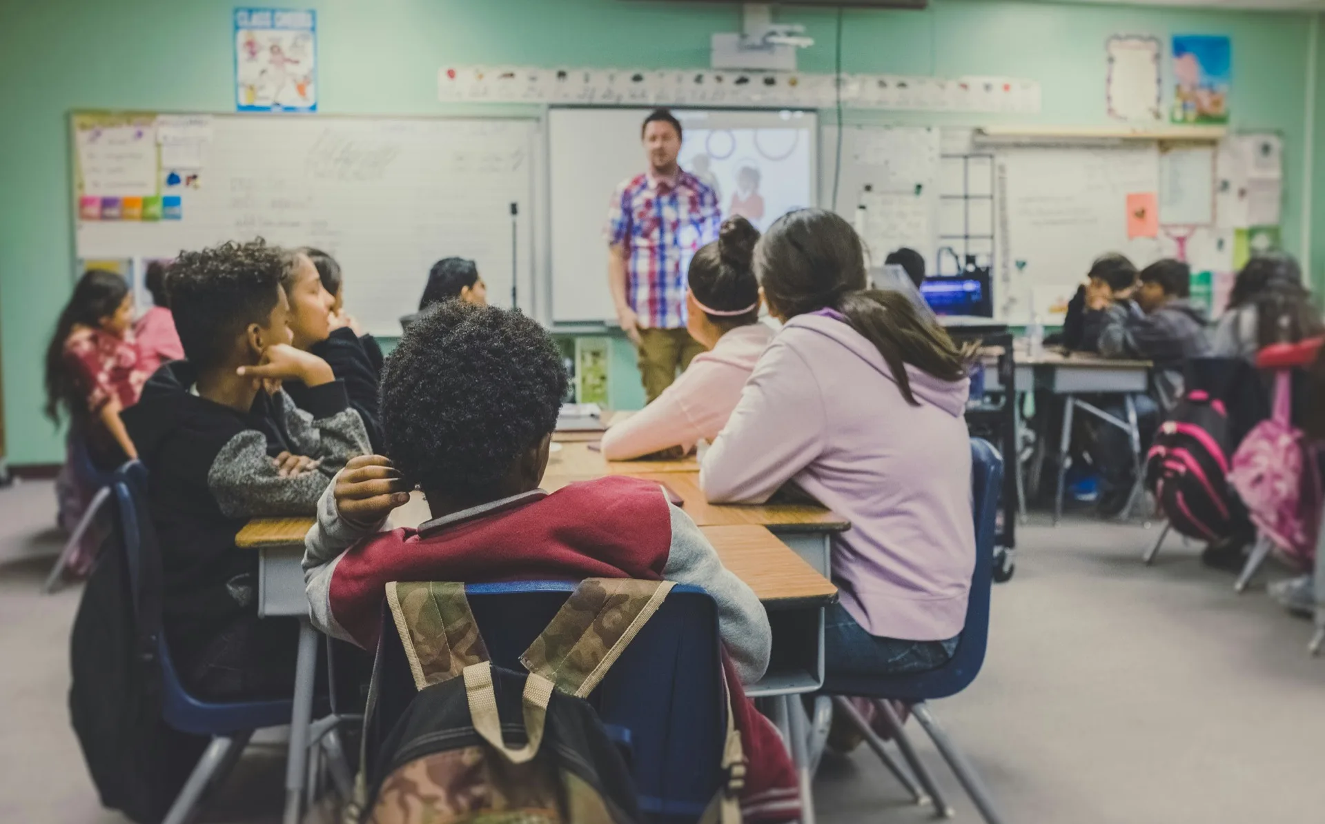 Teacher presenting to students in classroom